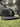 Cutternation Black/Black snapback front view in an indoor baseball facility