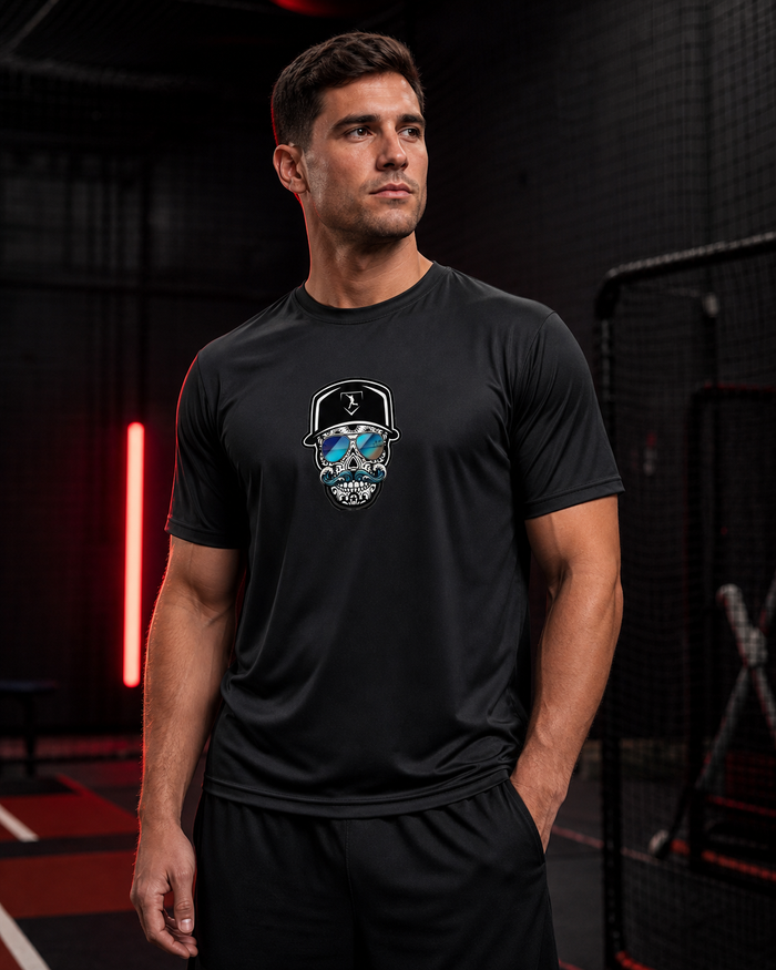 Cutternation Coastal Skull reflective-lens performance shirt worn by a baseball athlete in an indoor training facility