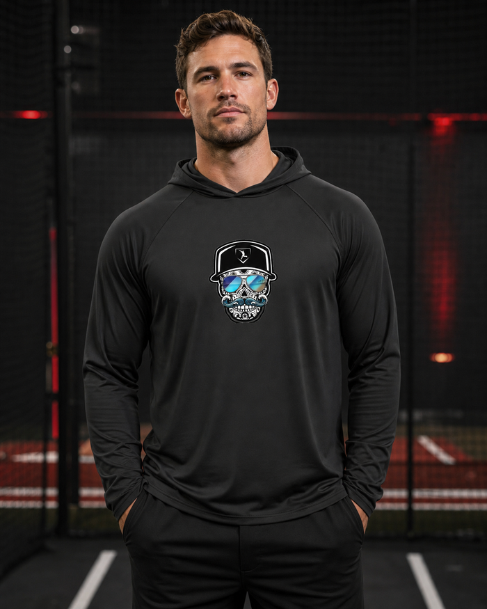 Cutternation Coastal Skull reflective-lens thin performance hoodie worn by a baseball athlete in an indoor training facility