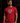 Adult baseball athlete wearing the red American Flag Cutternation performance tee in a dark batting facility