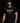 Adult baseball athlete wearing the black Bangerz Cutternation tri-blend tee in a dark batting facility