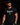 Adult baseball athlete wearing the black Bangerz Cutternation tri-blend tee in a dark batting facility