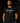 Adult baseball athlete wearing the black Been There Cutternation tri-blend tee in a dark batting facility