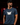 Adult baseball athlete wearing The Joker Taylor Ahearn navy signature tee in a dark Cutternation batting facility