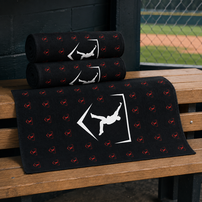 Three black Cutternation 30 x 60 training towels displayed together on a baseball dugout bench