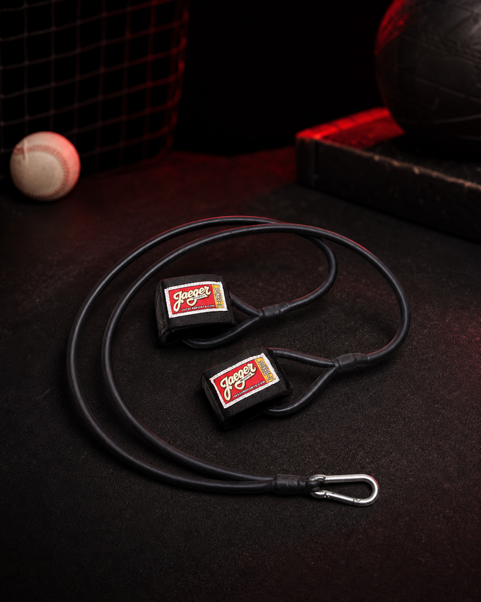 Black J-Bands baseball arm care bands in a dark Cutternation bullpen setting