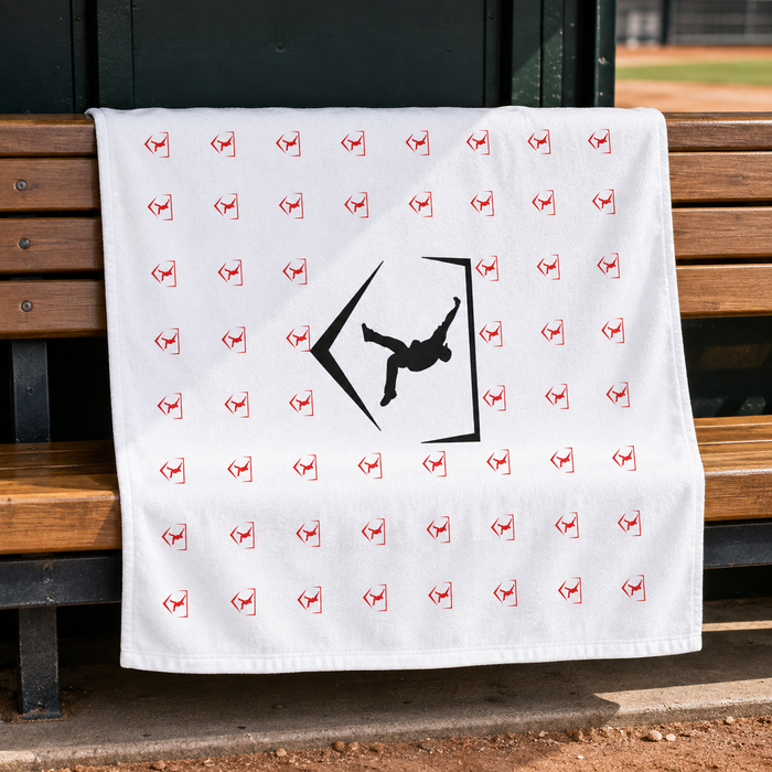 White Cutternation 30 x 60 training towel displayed on a baseball dugout bench