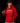 Youth baseball player wearing a red Cutternation script logo hoodie in a dark batting cage