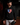 Youth pitcher wearing a black Cutternation American flag home plate hoodie in a dark bullpen
