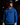 Youth baseball player wearing a royal blue Cutternation Bangerz hoodie in a dark batting cage