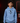 Youth pitcher wearing a Carolina blue Cutternation black home plate logo hoodie in an indoor bullpen