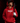 Teen baseball player wearing red Cutternation Gaming Logo youth hoodie in a dark batting cage