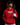 Teen baseball player wearing red Cutternation Gaming Logo youth hoodie in a dark batting cage