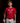 Youth hitter wearing a red Cutternation crossed-bats home plate T-shirt in an indoor batting cage