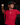 Youth pitcher wearing a red Cutternation Home Plate Logo T-shirt in an indoor baseball training facility