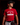Teen baseball player wearing red Cutternation Let It Fly Factory youth T-shirt in a dark training facility