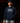 Youth pitcher wearing the navy Cutternation Live or Die By Your Best Pitch hoodie in an indoor training facility