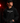 Youth pitcher wearing a black Cutternation Pitching Gangster hoodie in a dark bullpen