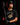 Teen baseball hitter wearing black Cutternation Punching Tickets youth T-shirt in a dark batting cage