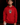 Youth baseball player wearing the red and yellow Cutternation Day of the Dead hoodie in an indoor batting cage