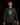 Youth baseball player wearing the Cutternation Shamrock Skull thin hoodie in an indoor training facility