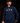Teen baseball player wearing navy Cutternation Strength youth hoodie in a dark training facility