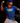 Youth pitcher wearing a blue Cutternation Strikeout Savage T-shirt in a dark training facility