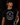 Teen baseball player wearing black Cutternation Strikeout Season youth T-shirt in a dark training facility
