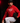 Youth pitcher wearing a red Cutternation Strikeout Season hoodie in a dark indoor bullpen