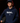 Teen baseball player wearing navy Cutternation Weird youth hoodie in a dark training facility