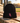 SDCC black performance beanie with cardinal sword K on a baseball field