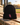 SDCC black performance beanie with cardinal sword K on a baseball field