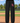 SDCC black sweatpants with small cardinal K thigh print on a baseball field
