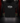 Youth Baseball T-Shirt — Cutternation Strong — Cutternation 4:5 product hero in a black and red indoor baseball training facility
