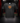 Youth Baseball T-Shirt — Gingerbread Cookie — Cutternation 4:5 product hero in a black and red indoor baseball training facility
