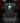 Youth Baseball T-Shirt — Green Holiday — Cutternation 4:5 product hero in a black and red indoor baseball training facility
