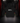 Youth Baseball Hoodie — Lineas — Cutternation 4:5 product hero in a black and red indoor baseball training facility