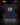 Youth Live at Bats Short Sleeve Tee — Cutternation 4:5 product hero in a black and red indoor baseball training facility