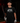 Youth baseball player wearing the Cutternation Live or Die by Your Best Pitch black T-shirt in an indoor training facility