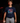 Youth baseball player wearing the Cutternation Vice navy T-shirt in an indoor training facility